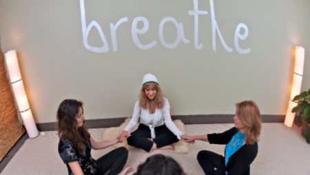 3 Women practicing breath exercise